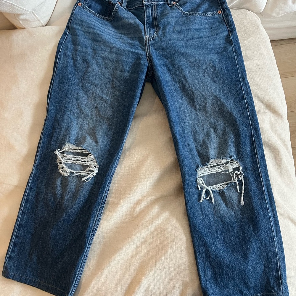 Distressed Levi’s straight leg jeans